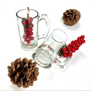 Two heavy glass Holiday mugs. Sold as a set.